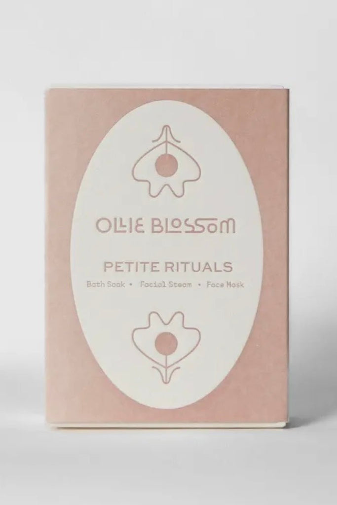 a pink box that says "petite rituals" and includes a bath soak, facial steam, and face mask