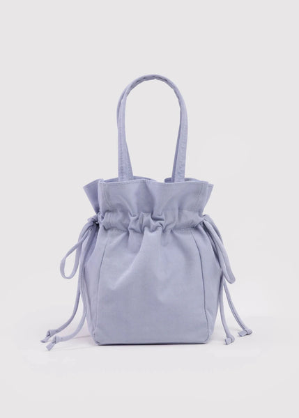 Light blue drawstring bag on a light gray background