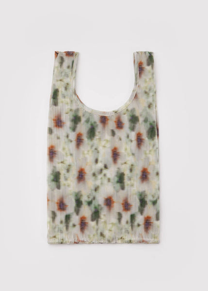 Reusable shopping bag with a floral pattern on a white background