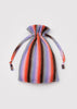 Multicolored striped drawstring bag on a light gray background