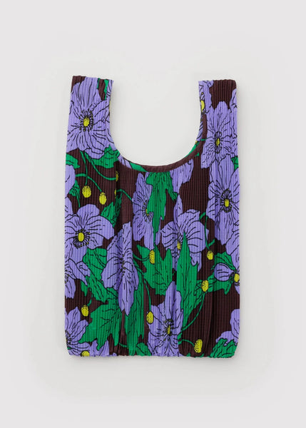 Reusable shopping bag with purple floral pattern on a white background