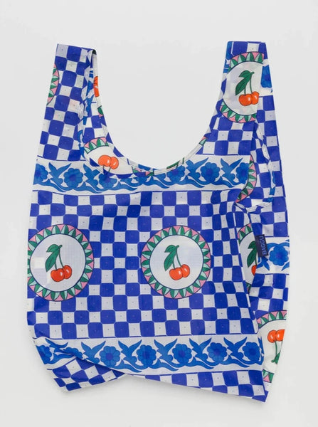 a blue checkerboard flower and cherry patterned reusable baggu bag on a white background
