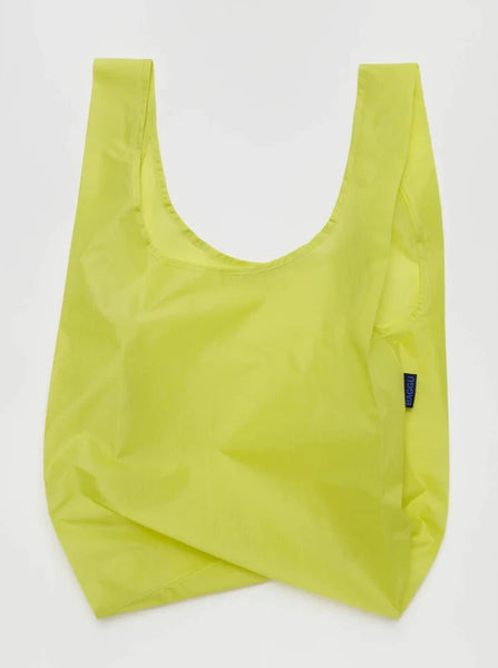 a lemon yellow reusable baggu bag on a white background
