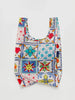 a baby baggu reusable bag with a sunshine tile pattern on a white background