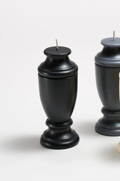 ckmolded black beeswax candle shaped like an urn