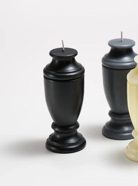 ckmolded black beeswax candle shaped like an urn
