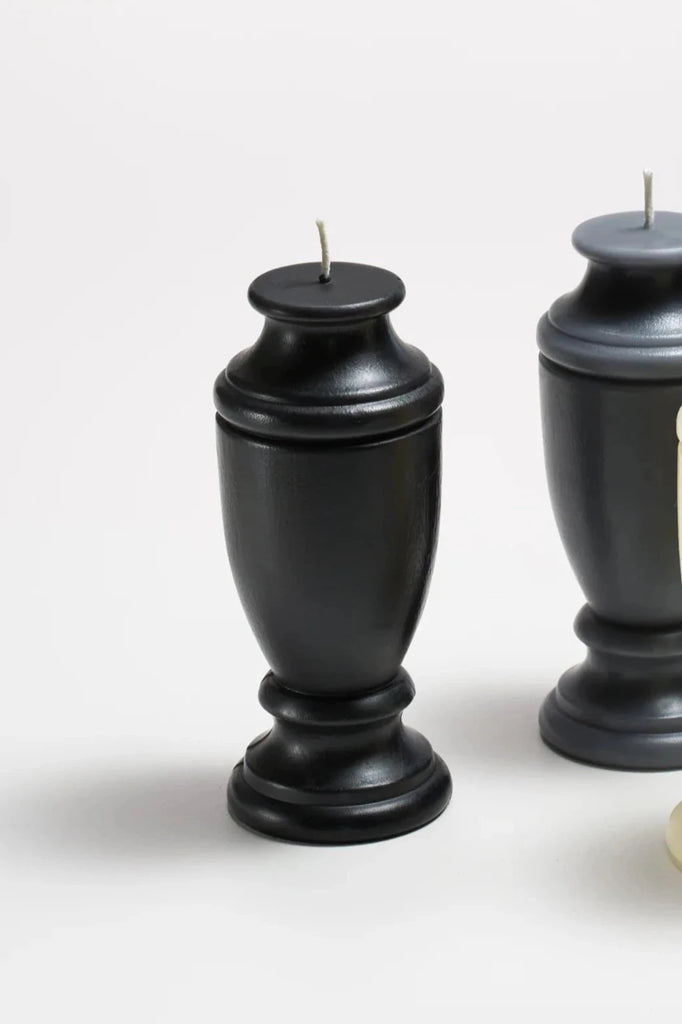 ckmolded black beeswax candle shaped like an urn