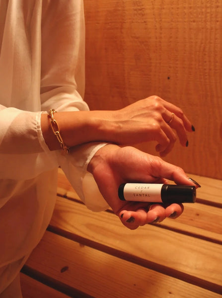a black perfume oil roller scented with cedar and Santal 