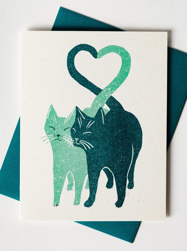 card with two green cats nuzzling and curling their tails making a heart shape
