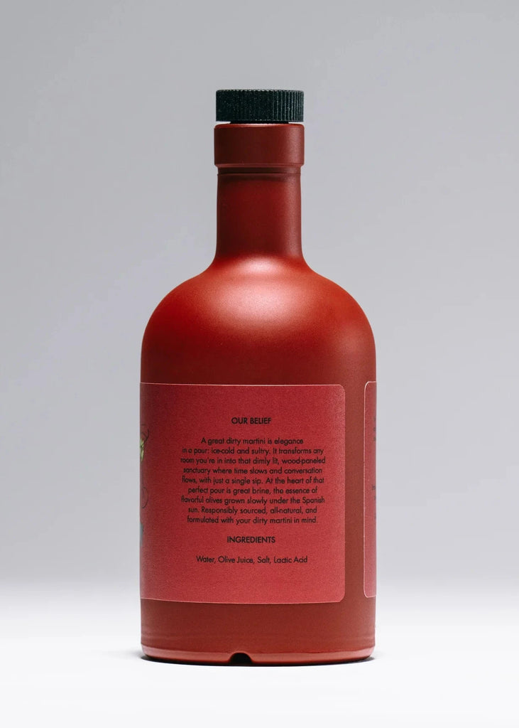 Red bottle with a black cap on a gray background