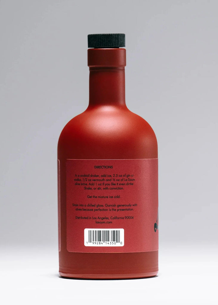 Red bottle with a black cap on a gray background