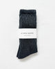 Pair of Charcoal socks with a white 'Le Bon Shoppe' label on a light gray background