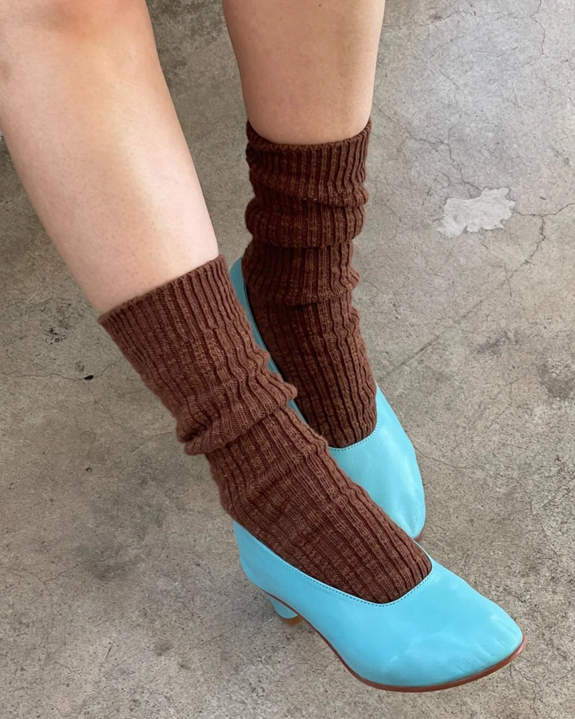 A pair of legs wears a pair of cottage socks from Le Bon Shoppe in the color Bear paired with turquoise leather heels