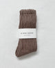 Pair of Mocha Mousse ribbed ballet socks with a 'Le Bon Shoppe' label on a light gray background