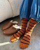 A person's legs wearing a pair of Wally Socks from Le Bon Shoppe in the color Camel