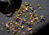 Dried flowers and leaves on a dark surface