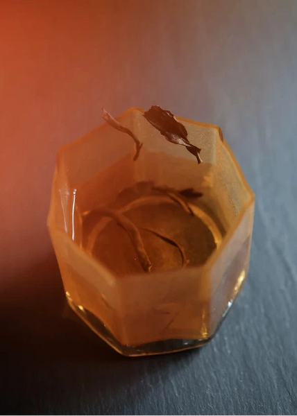 mountain beauty black tea brewing in a small clear glass