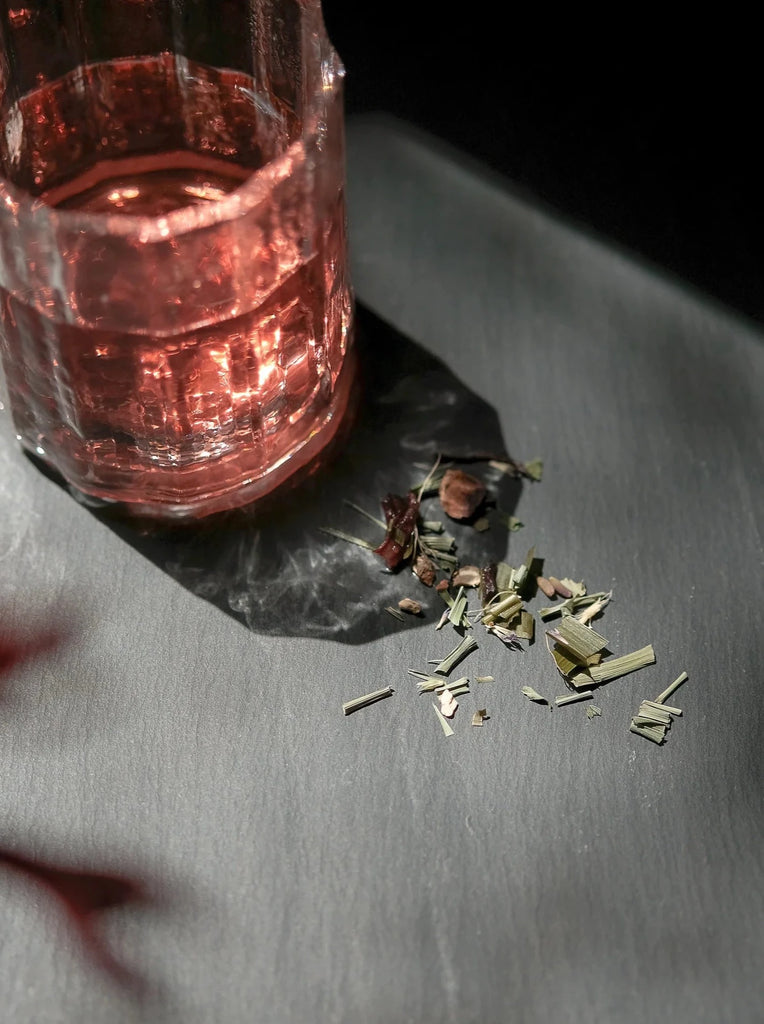 tropic garden tea spilled on a slate background