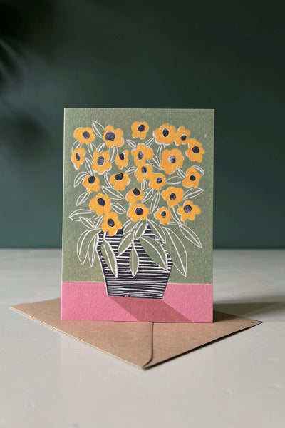 A greeting card with an illustration of a vase of black eyed susan flowers by Luiza Holub.