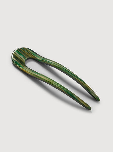 a meadow green French hair pin by machete sitting on a white background.