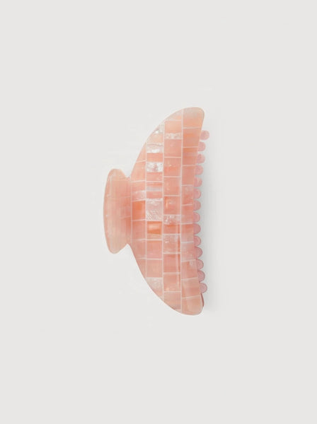 an apricot shell midi heirloom claw hair clip by machete sits on a white background.