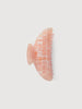 an apricot shell midi heirloom claw hair clip by machete sits on a white background.