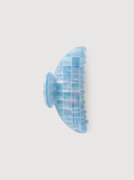 a light blue shell midi heirloom claw hair clip by machete sits on a white background.