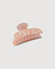 an apricot shell midi heirloom claw hair clip by machete sits on a white background.