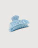 a light blue shell midi heirloom claw hair clip by machete sits on a white background.