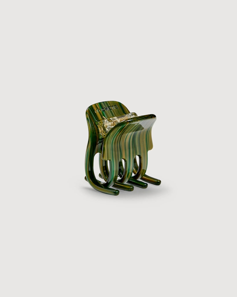 a meadow green mini claw hair clip by machete sits on a white background.