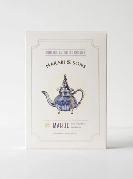 a box of makabi and sons rose cardamom and pistachio shortbread cookies with an illustration of a teapot on the front