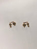 14k gold filled post earrings with asymmetrical beads inspired by Asian lanterns, made by Marida jewelry, sit on a white background