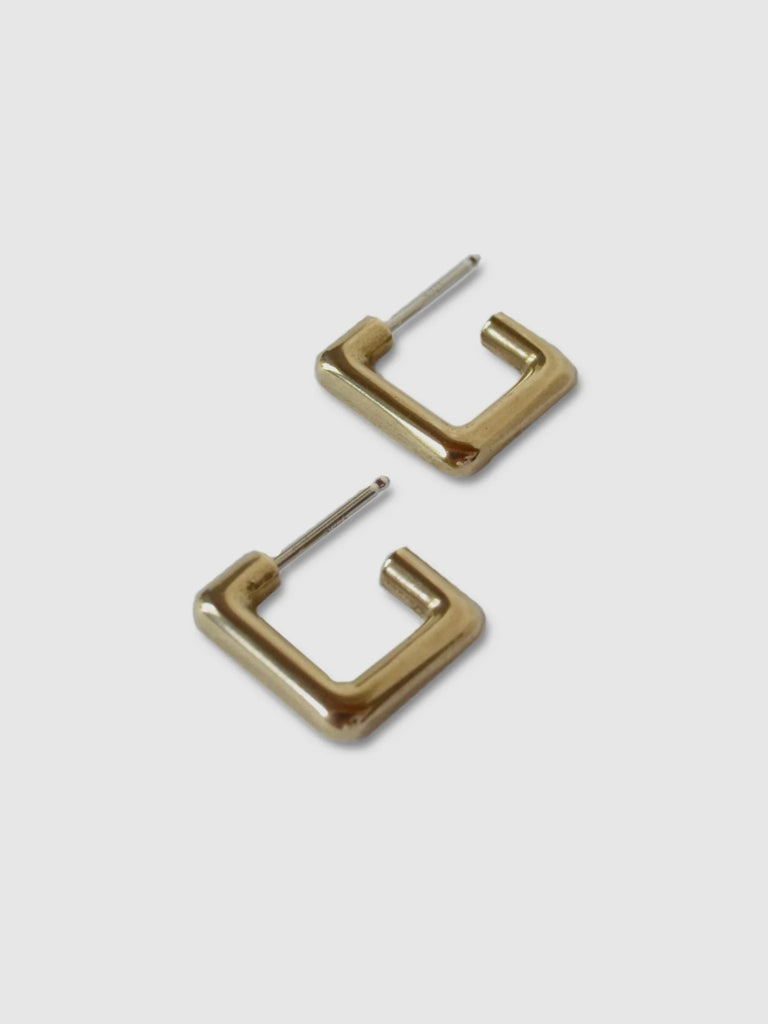 a pair of small square brass hoops on a white background - made by Natalie joy jewelry