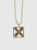 a necklace made by Natalie joy jewelry in brass that looks like a flower inside a square