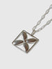 detail of a necklace made by Natalie joy jewelry in sterling silver that looks like a flower inside a square