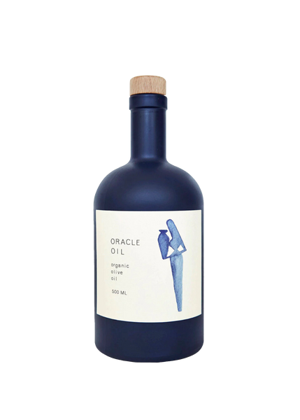 Navy blue bottle of olive oil with a white label featuring an illustration of a woman holding a vase on a white background