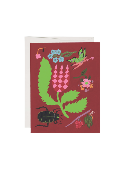 Greeting card with nature-themed design on a red background