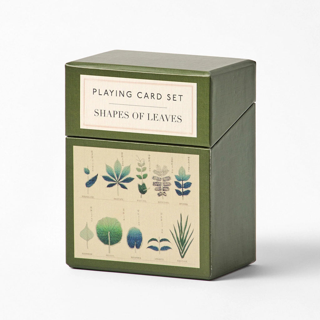 a playing card set featuring illustrations of leaves, boxed on a white background.