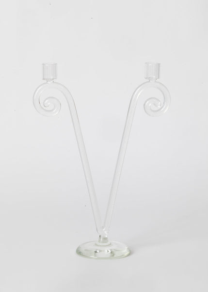 Clear glass candle holder with spiral design on a white background