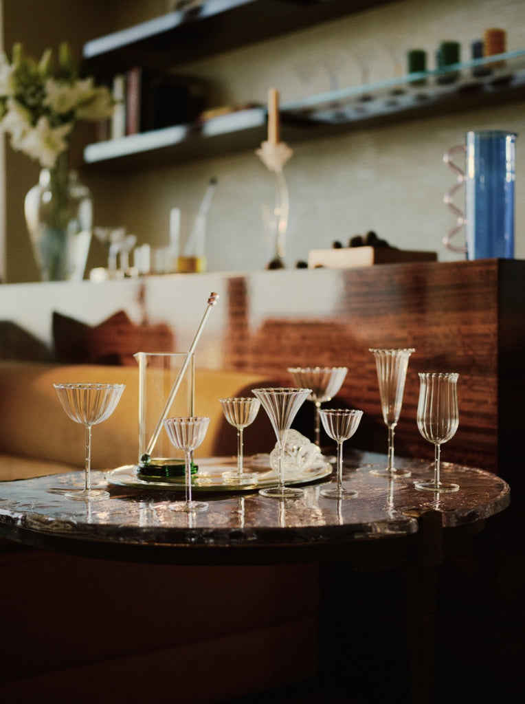 clear bar glass collection by Sophie Lou Jacobsen styled on a marble table inside a bar