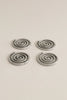 four silver spiral metal coasters 