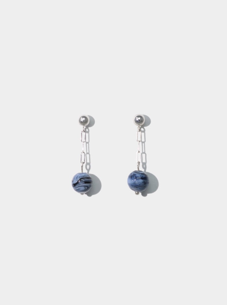 Two cled small drop earrings with sterling silver balls and drop sterling silver chain connected to a dark and light blue swirled repurposed glass gems 