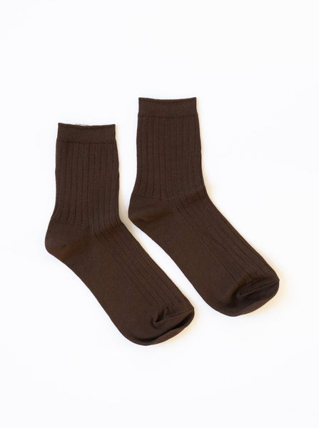 A coffee brown pair of ribbed le bon shoppe her socks against a white background 