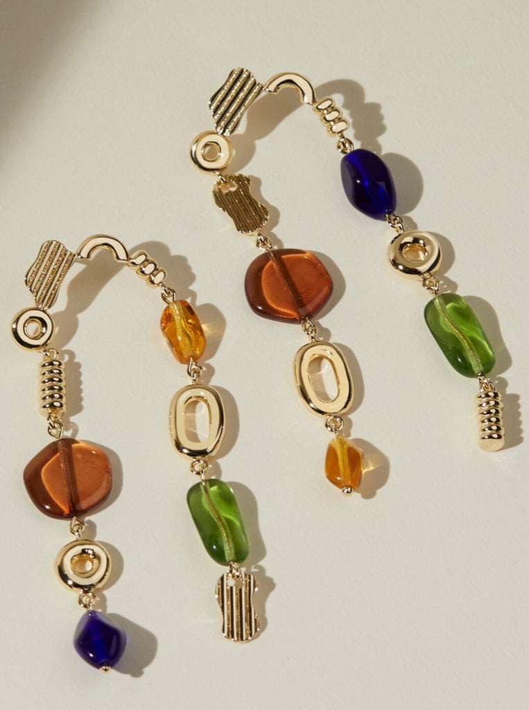 gold dangle earrings with blue, brown, and green glass beads and multiple gold shapes made by Lindsay Lewis