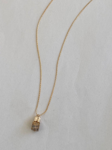 Long gold necklace with an earth tone jasper square pendant 