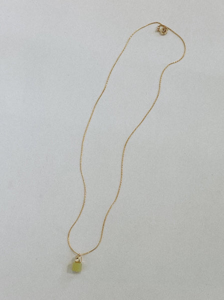 Long gold necklace with a milky olive jade pendant 