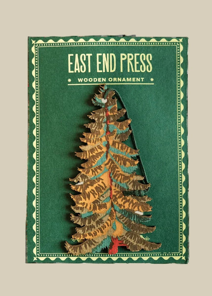 Wooden Christmas tree ornament with 'East End Press' packaging on a white background