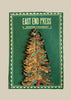 Wooden Christmas tree ornament with 'East End Press' packaging on a white background